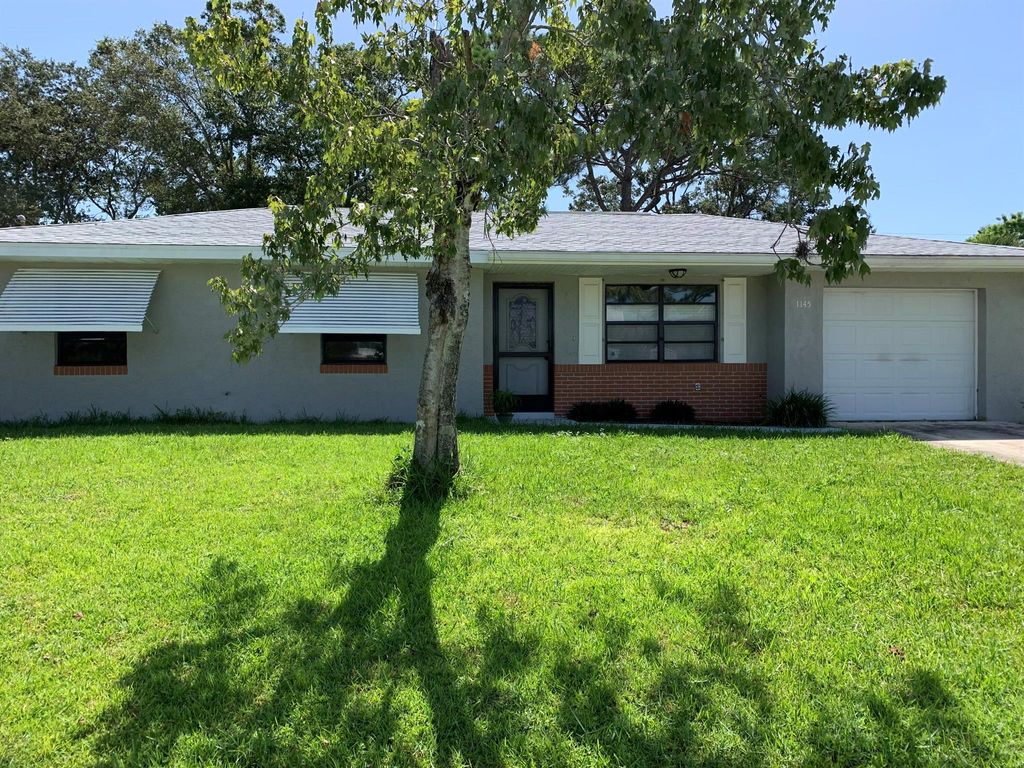 Photo of 1145 SW Ivanhoe Street, Port St Lucie, FL 34983 (MLS # R10910460)