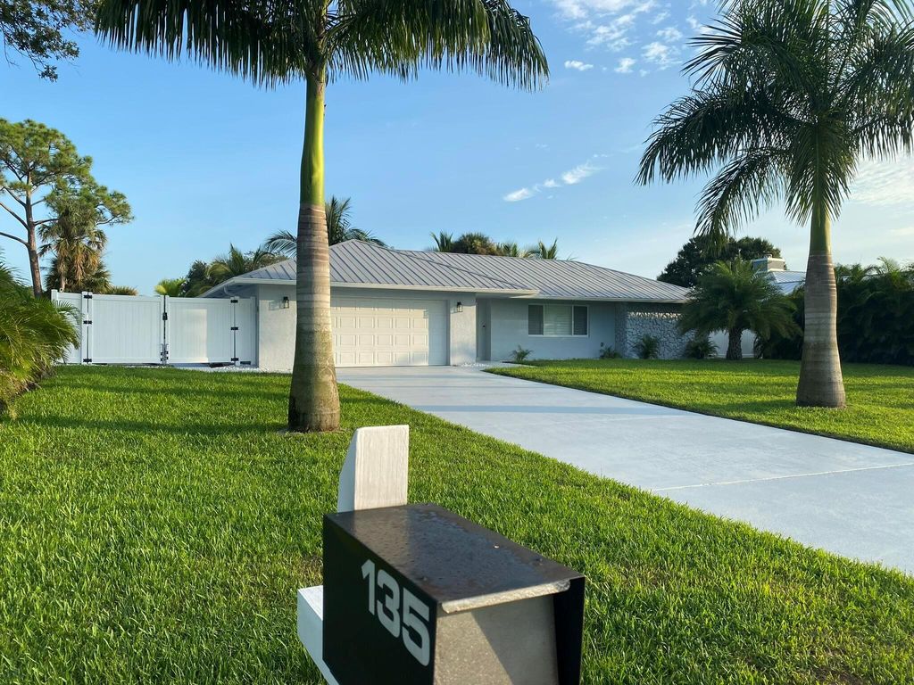 Photo of 135 NE Naranja Avenue, Port Saint Lucie, FL 34983 (MLS # R11048193)