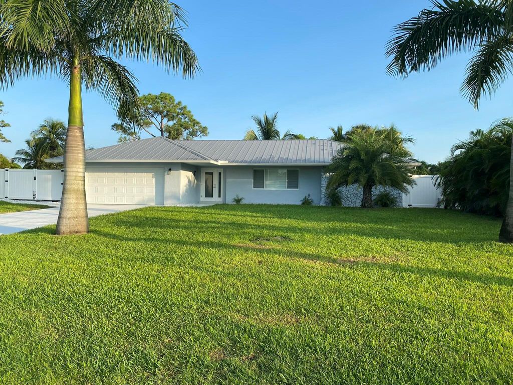 Photo of 135 NE Naranja Avenue, Port Saint Lucie, FL 34983 (MLS # R11048193)