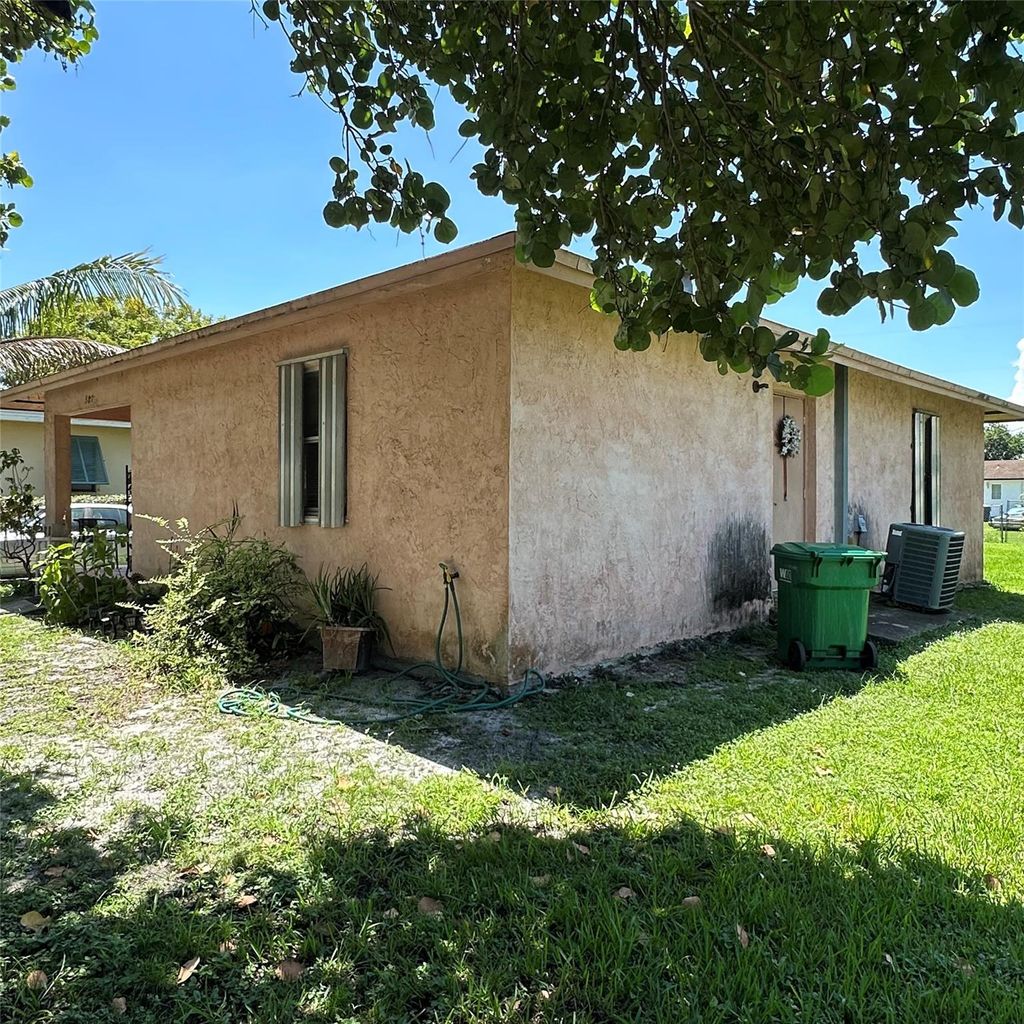 Photo of 387 Cypress Avenue, Pahokee, FL 33476 (MLS # F10523875)