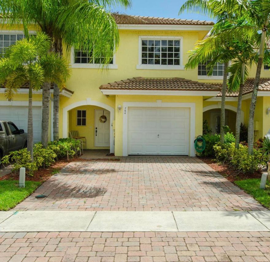 Gorgeous updated 3 bedroom 2 bath townhome in gated community. Crown moulding throughout, updated kitchen with granite countertops and stainless steel appliances. Updated baths. Quality laminate wood flooring and tile throughout. Patio overlooking lake. Fenced yard. Pet friendly community. Great location with easy access to shopping, schools, beaches and highways.