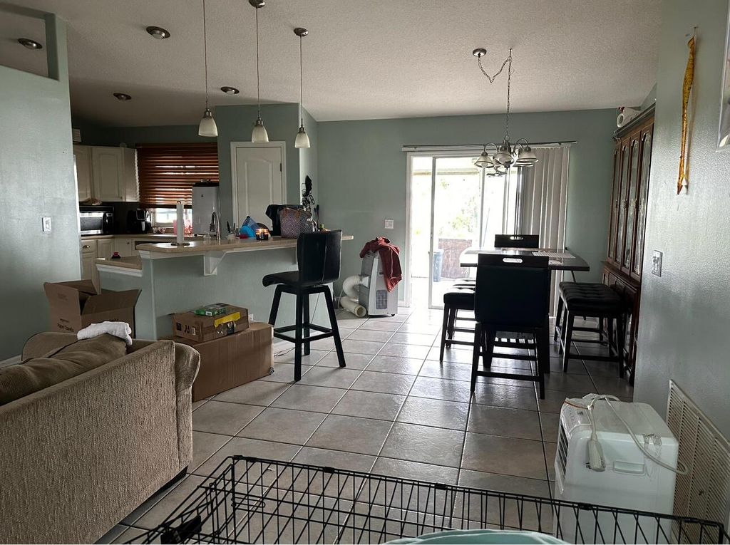 Photo of 442 SW Jeanne Avenue, Port Saint Lucie, FL 34953 (MLS # R10993534)