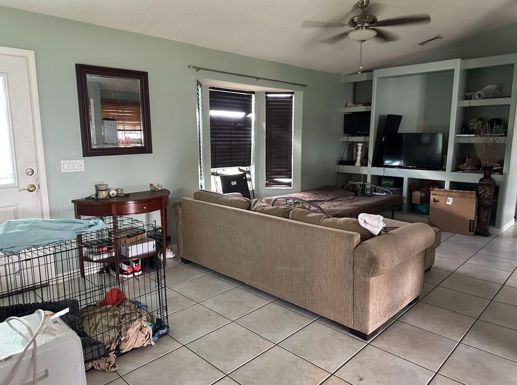 Photo of 442 SW Jeanne Avenue, Port Saint Lucie, FL 34953 (MLS # R10993534)