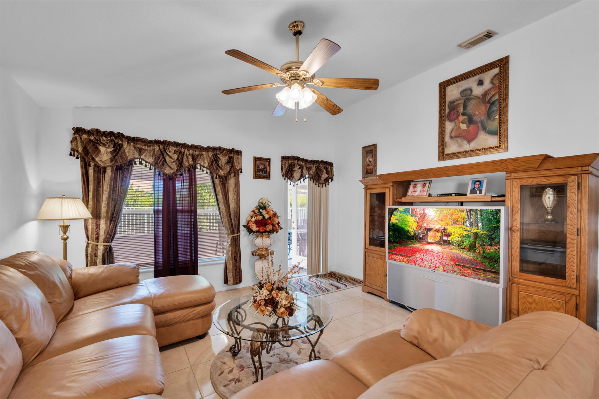 Location! Location! close to everything and everywhere! This home is well maintained and was used basically as a vacation home.Buyers you will love that big screened in patio with beautiful tiles ready for the family parties! This community is gated and has one of the lowest HOA which is hard to find. This community is well maintained and offers a lot for the family to enjoy such as a beautiful club house, fitness center, pool, tennis court and much more!The home is vacant and easy to show. Be sure to see this one!