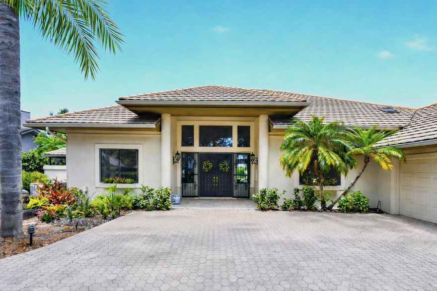 Experience elevated living in the exclusive Mariner Sands Country Club, where sweeping water and golf course views create a breathtaking backdrop for this exceptional residence. Spanning 3,783 square feet, this 3-bedroom, 4-bath home is perfectly positioned to capture both privacy and panoramic scenery. Designed for indoor-outdoor living, the expansive screened lanai showcases a resurfaced pool and a new enclosure (2022) with windowpane screens, offering uninterrupted views of the water and fairways. Inside, the family room with 18' ceilings and separate dining area provide ideal settings for both relaxed living and entertaining. The elegant kitchen features brass fixtures and quartz countertops, along with a beautiful 6 burner gas range and double ovens. The generously sized primary suite is complete with a large walk-in closet, an additional flex room perfect for an office or second closet, and a spa-like bath with a Jacuzzi tub and a striking walk-in shower accented with nautical blue tile.  Both guest bedrooms offer private ensuite baths. Additional highlights include a golf cart garage, workshop space, and a circular driveway, all within one of the Treasure Coast's most sought-after private golf communities.  Residents enjoy two championship 18-hole golf courses, Har-Tru tennis courts, pickleball, croquet, and a state-of-the-art fitness center. The community also features a resort-style pool with a separate lap pool, along with the Sand Bar offering exceptional indoor and outdoor casual dining. The spectacular new clubhouse provides both fine and casual dining, along with weekly social events and happy hours. Additional amenities include a dog park, playground, spa, and nail salon—all just minutes from pristine beaches and charming downtown Stuart. Social membership is required with a one-time capital contribution of $50,000 due at closing. Golf membership is separate and optional.