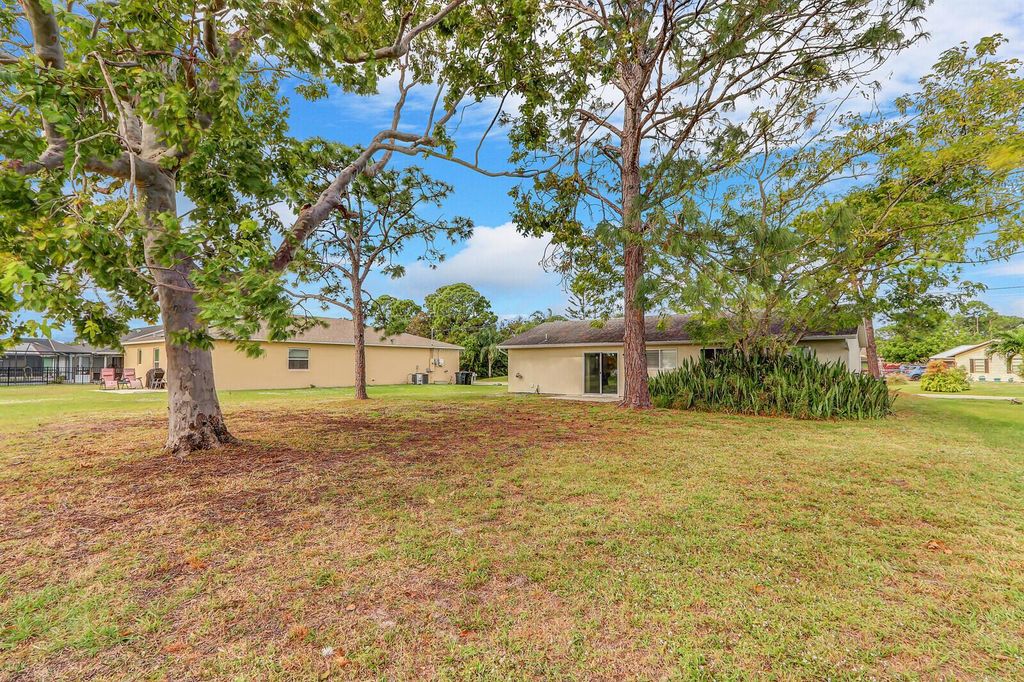 Photo of 1551 SE Flintlock Road, Port Saint Lucie, FL 34952 (MLS # R10942983)