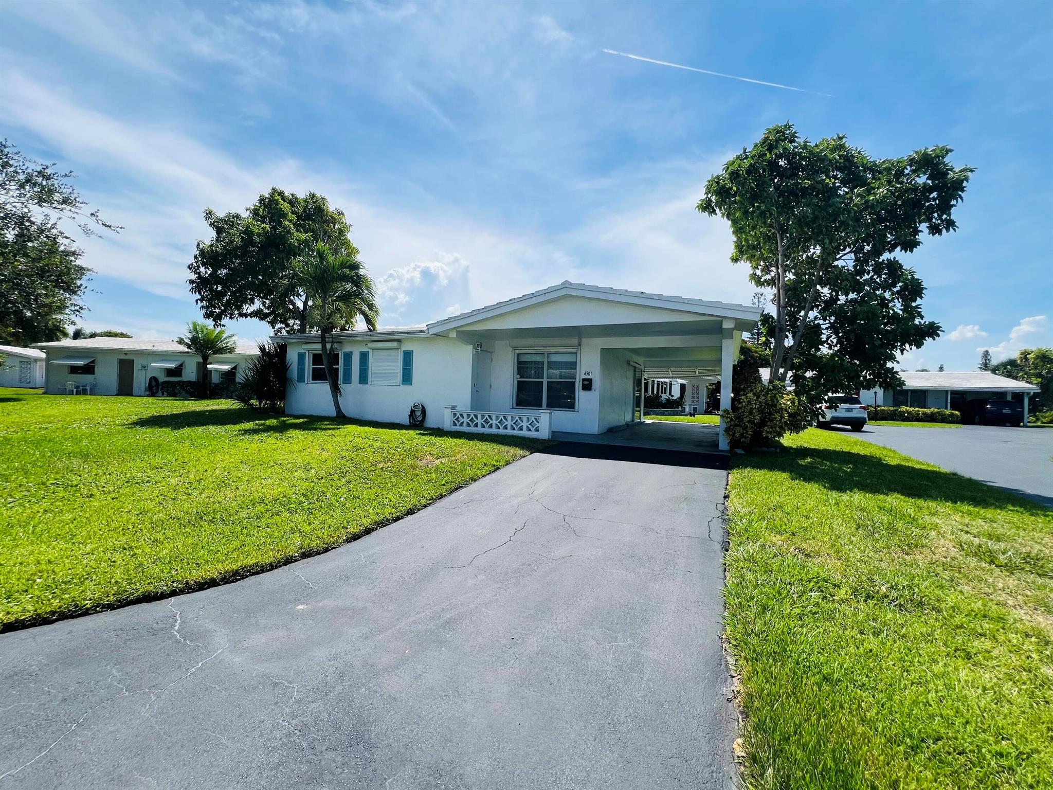 Beautifully updated 2-bedroom, 1-bath corner-lot single-family home in a quiet, family-friendly community with LOW HOA and NO HOPA! This rental-friendly gem features sleek tile flooring, a spacious walk-in closet, and modern stainless-steel appliances--including a glass-top stove, microwave, and full-size washer/dryer. Enjoy a covered 2-car carport and optional stylish furniture. Unbeatable location near I-95, major highways, public transit, shopping, dining, and just minutes to stunning beaches!