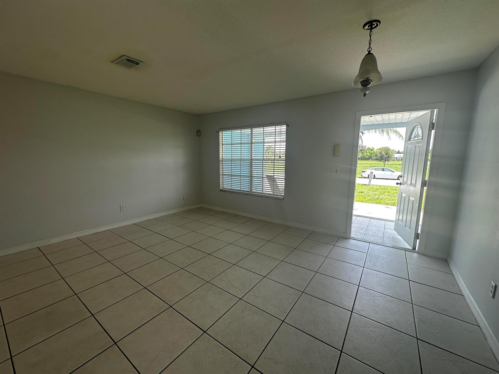 Answer Model with large kitchen, dining room next to kitchen and large living room.Completely painted inside in June and painted exterior 6 months ago. Washer in garage and screened porch with fruit trees in back yard and on wide back yard with drainage (no water). Minutes to beaches for swimming and fishing. Available immediately.