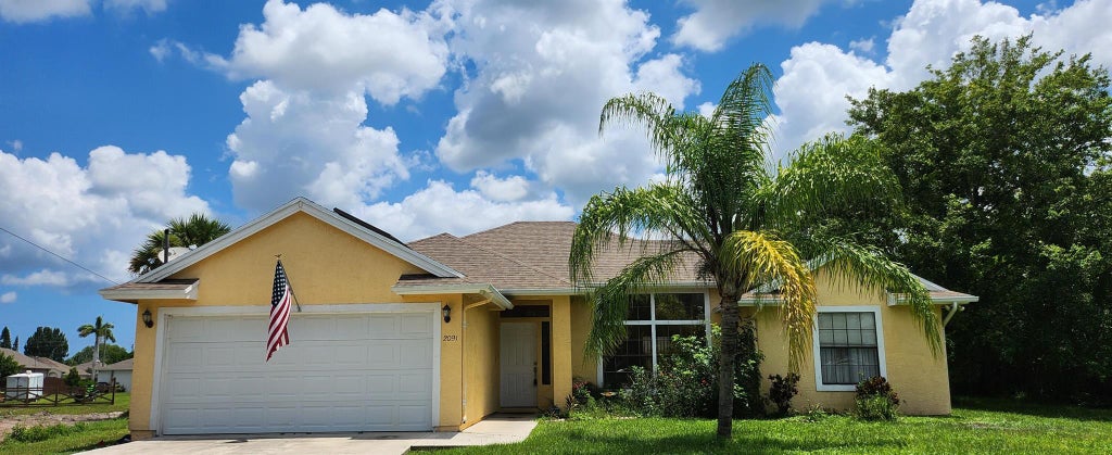 Photo of 2091 SW Castinet Lane, Port St Lucie, FL 34953 (MLS # R10911037)