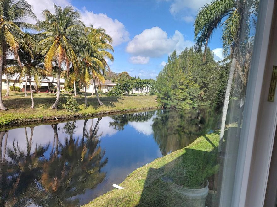 Beautiful and bright corner unit in a 55+ senior community. 2nd floor with great views. Professionally remodeled. Canal view from every room. Impact glass windows. Enclosed balcony. Tiles throughout. Split bedrooms. Large walk-in Closet. Furniture is negotiable. Extra storage. Lobby secure building. Clubhouse with gym, library, game room. heated pool and tennis court. Maintenance includes water, fiber optic cable and high-speed internet. Centrally located. No rentals are allowed. Best of Florida living with this impeccably maintained Condo. Excellent value.