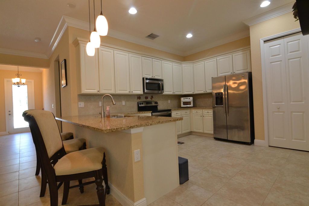 Photo of 9995 SW Ambrose Way, Port St Lucie, FL 34986 (MLS # R11052856)