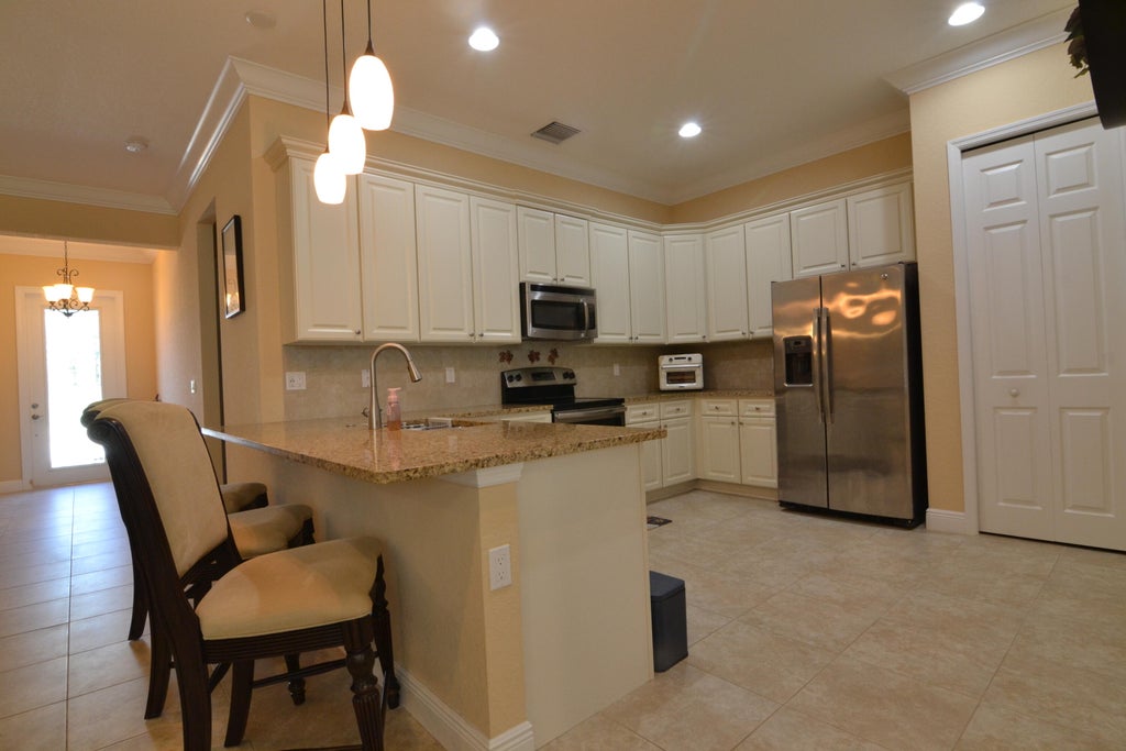 Photo of 9995 SW Ambrose Way, Port Saint Lucie, FL 34986 (MLS # R11052856)