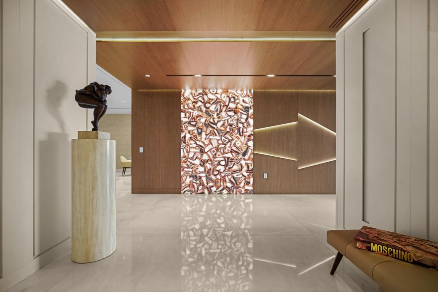 Boca Beach Residences, waterfront Luxury living on Lake Boca! Perfectly positioned directly across the water from The Boca Raton & a short walk to The Boca Beach Club. This Exceptional 4,200 SF residence was meticulous designed by a top designer. It showcases statement millwork with integrated LED inlay lighting throughout, 48'' x 48'' marble flooring, a foyer that welcomes you with a dramatic agate stone feature and a fully custom chef's kitchen designed by Mia Cucina and exceptional appliances by Gaggenau. This home features a primary suite directly on Lake Boca with a generous balcony to enjoy your morning coffee or a cocktail at night.  A custom closet to feature your beloved possessions as if you were in a high end department store and a bathroom with a wet room and steam shower that rivals any spa. The guest suite is gorgeous and comfortable with access to a balcony and a large bathroom. The club room is spectacular with wood paneling, cork wallpaper, marble slab inlay on the wall behind the desk and a large balcony. The clubroom also features a full bath, reach in closet and corner closet, easily converted into a third bedroom. Open family and living room are accentuated by floor to ceiling sliders that highlight the views of the intracoastal. The sliders open wall to wall and lead to a generous balcony where one can enjoy watching the yachts go by.... This home includes a dedicated boat slip accommodating a 50' vessel, along with 4 car garage spaces, 2 of which are privately enclosed to keep your favorite cars. Residents enjoy a full service luxury building offering a resort-style pool and grilling area, state of the art fitness center, valet parking, concierge services, 24 hour doorman & private security.