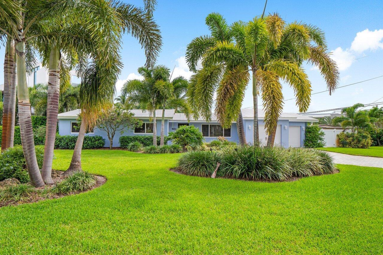 ONE OF A KIND DOWNTOWN BOCA GEM! WALK TO MIZNER PARK AND ALL THAT DOWNTOWN BOCA HAS TO OFFER! This Totally Renovated 3/3 has complete Hurricane Protection for maximum insurance discount. All impact doors & windows for lots of natural light! Quartz & Stainless Chefs Kitchen with oversized Island for Gourmet Prep or Buffet Style Entertaining. Dining Area boasts WOOD BURNING FIREPLACE with room for LARGE DINING TABLE. Tropical mature Landscape surrounds Private Covered Paver Patio! Master Bedroom boasts 2 separate closets and spacious Master Bath with Marble Vanity and Double Sinks. All Plumbing has been replaced in the home during renovation. Split bedroom plan with 2 on one side of house and 3rd completely separate with on suite bath. Large 2 car garage & indoor A/C Laundry Room!