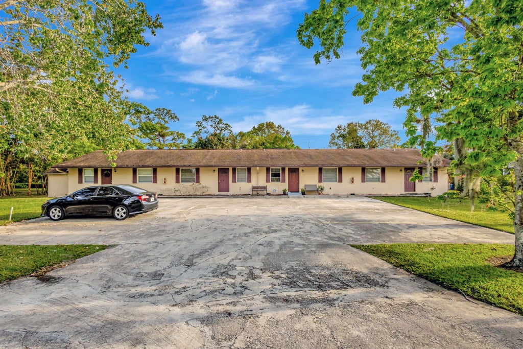 Photo of 732 SW Gardens Boulevard, Palm City, FL 34990 (MLS # R11058056)