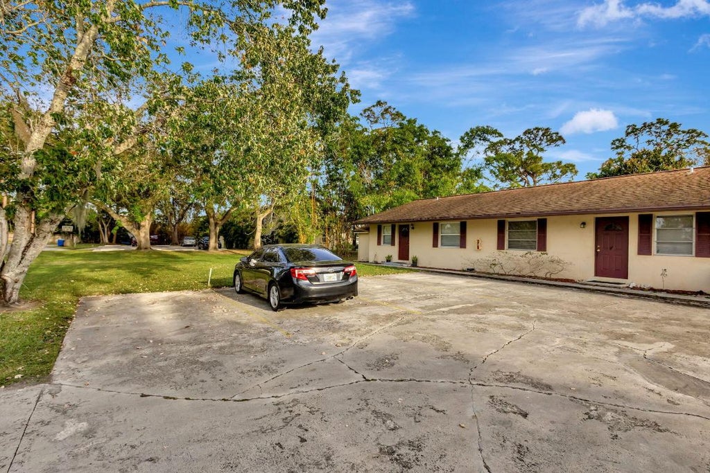 Photo of 732 SW Gardens Boulevard, Palm City, FL 34990 (MLS # R11058056)