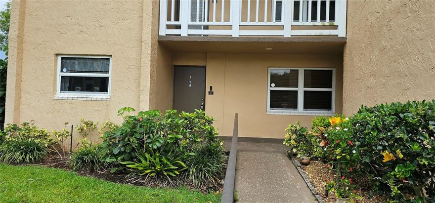First-floor corner unit overlooking the golf course.  Tile floors throughout.  Kitchen updated.  Unit is in ready to live in condition.  Impact windows. Extra spacious unit has an extended living area.  Large bedrooms.  Central A/C per seller is about 2 years old.  The electric panel was updated. Parking spacing is right by the front door.  Lots of activities, pool, gym, clubhouse, and many other activities.