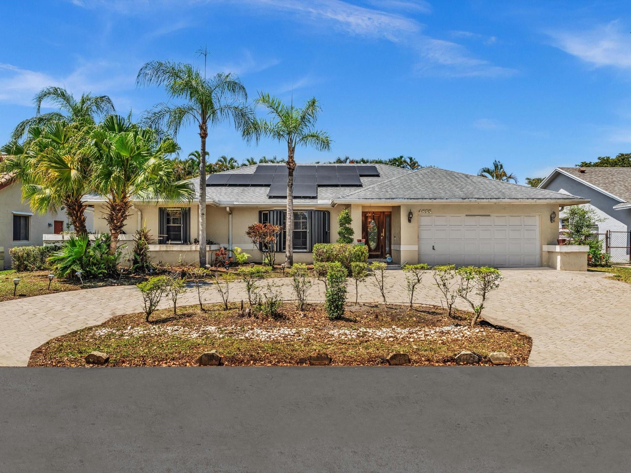 Welcome home to this spacious gem in desirable Winston Park neighborhood in Coconut Creek. This beautifully maintained 4/3 home offers privacy, charm and convenience in one perfect package. An updated master suite with elegant stone flooring. A converted, air-conditioned garage - perfect for a home office, fitness room, or bonus living space. A fully fenced backyard adorned with mature fruit trees, ideal for relaxing, gardening or entertaining by the enclosed pool. Home has solar panels and hurricane shutters. Just a short walk to Coconut Creek Promenade, with shopping, dining and entertainment with easy access to major highways. Don't miss this opportunity to own this home
