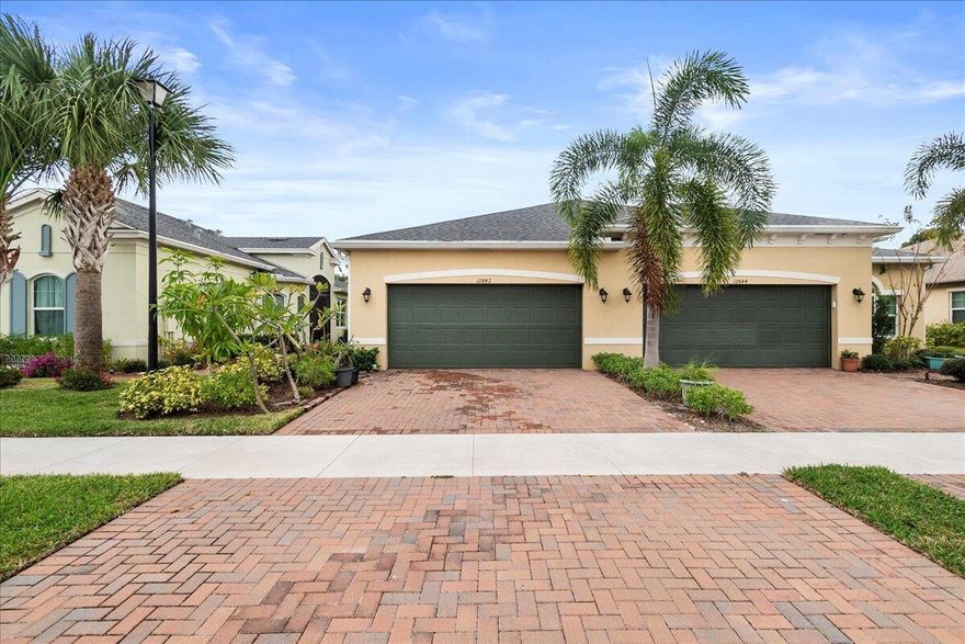 Welcome to effortless Florida living in this impeccably maintained one story, 2-bedroom plus den, 2-bath villa with 2-car garage located in the highly sought after 55+ community of LakePark at Tradition.  Designed for comfort and style, this inviting home features tile flooring throughout, ensuring a clean, cohesive, and low-maintenance lifestyle. The spacious, modern kitchen is a true highlight, offering stainless steel appliances, elegant quartz countertops, and ample storage and its perfect for everyday meals or effortless entertaining. The open-concept layout seamlessly connects the kitchen, dining, and living areas, creating a warm and welcoming space ideal for gatherings or quiet relaxation. A versatile den adds flexibility as a home office, reading room, or an extra lounge area.