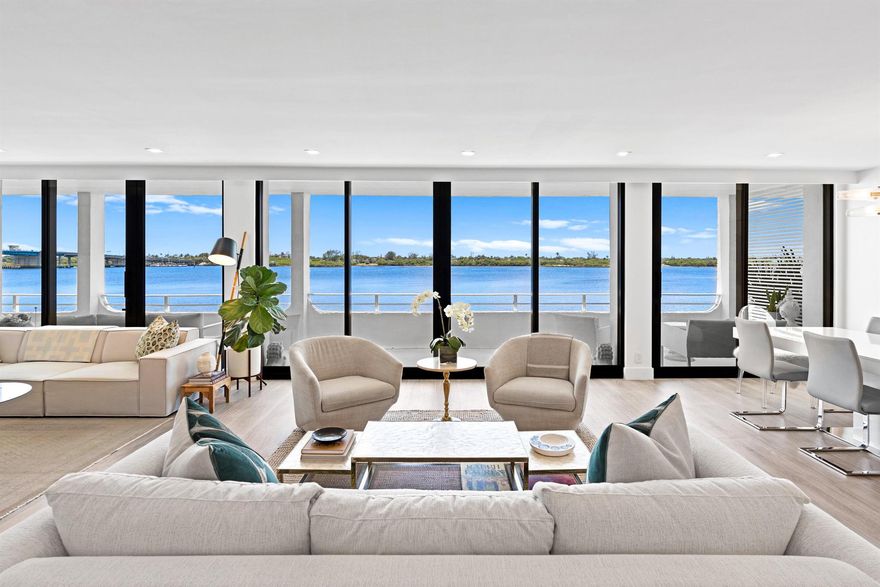 STUNNING NEW RENOVATION WITH DIRECT WATER VIEWS!! This unique direct waterfront corner residence is perfect for those searching for ULTIMATE PRIVACY. Situated on the south end of the property away from the pool area, it lives like a tranquil home floating above the intracoastal with the only private spiral staircase offering seamless access directly down to the manicured grass lawn right in front of the seawall. Boasting spectacular views of the water, yachts passing by and breathtaking sunsets from almost every room, this residence has it all! NO EXPENSE WAS SPARED and everything was replaced during this recent meticulous gut-renovation. Beautiful high-end porcelain floors, impressive open kitchen with Bosch appliances, Liebherr refrigerator, all new electrical, plumbing, water heater...