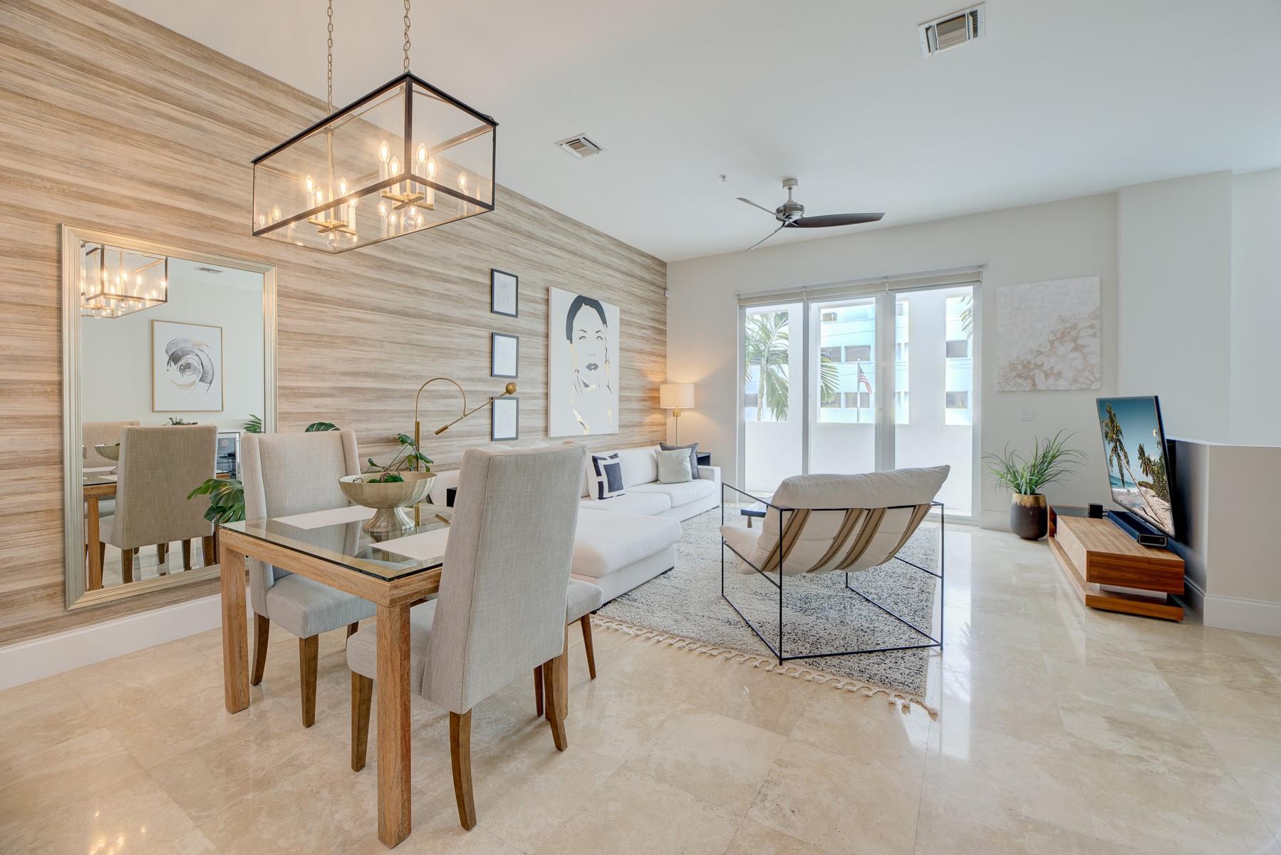 Meet one of the few modern commercially zoned live/work spaces in Flagler Village. Completely remodeled throughout, including a built-out ground floor retail unit. Perfect separate space for working from home or generate extra $$$ by renting out the commercial space separately. This townhome boasts 2 master suites & oversized 2-car garage, impact windows throughout, and an open living room layout with 2800+ square feet of living space. This is a great investment as Flagler Village is on the map for significant development. Live Downtown in this gated community with beautiful tropical courtyards and a community pool to relax on the weekends. Walk to restaurants, nightlife, coffee houses, and several fitness options and shopping in this pedestrian, pet-friendly village.