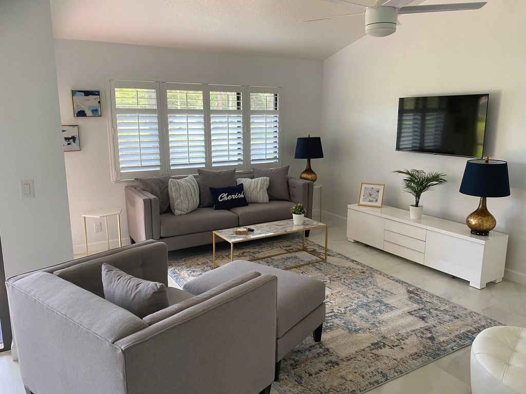 Photo of 6 Lexington Lane #D, Palm Beach Gardens, FL 33418 (MLS # R10994552)