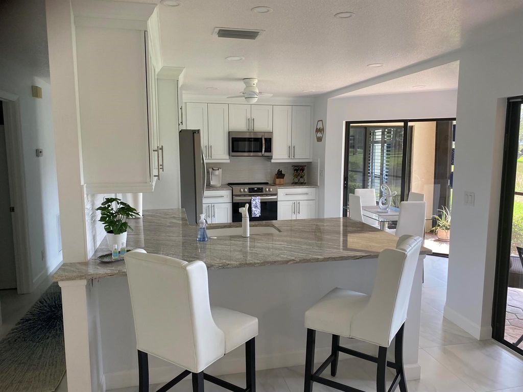 Photo of 6 Lexington Lane #D, Palm Beach Gardens, FL 33418 (MLS # R10994552)