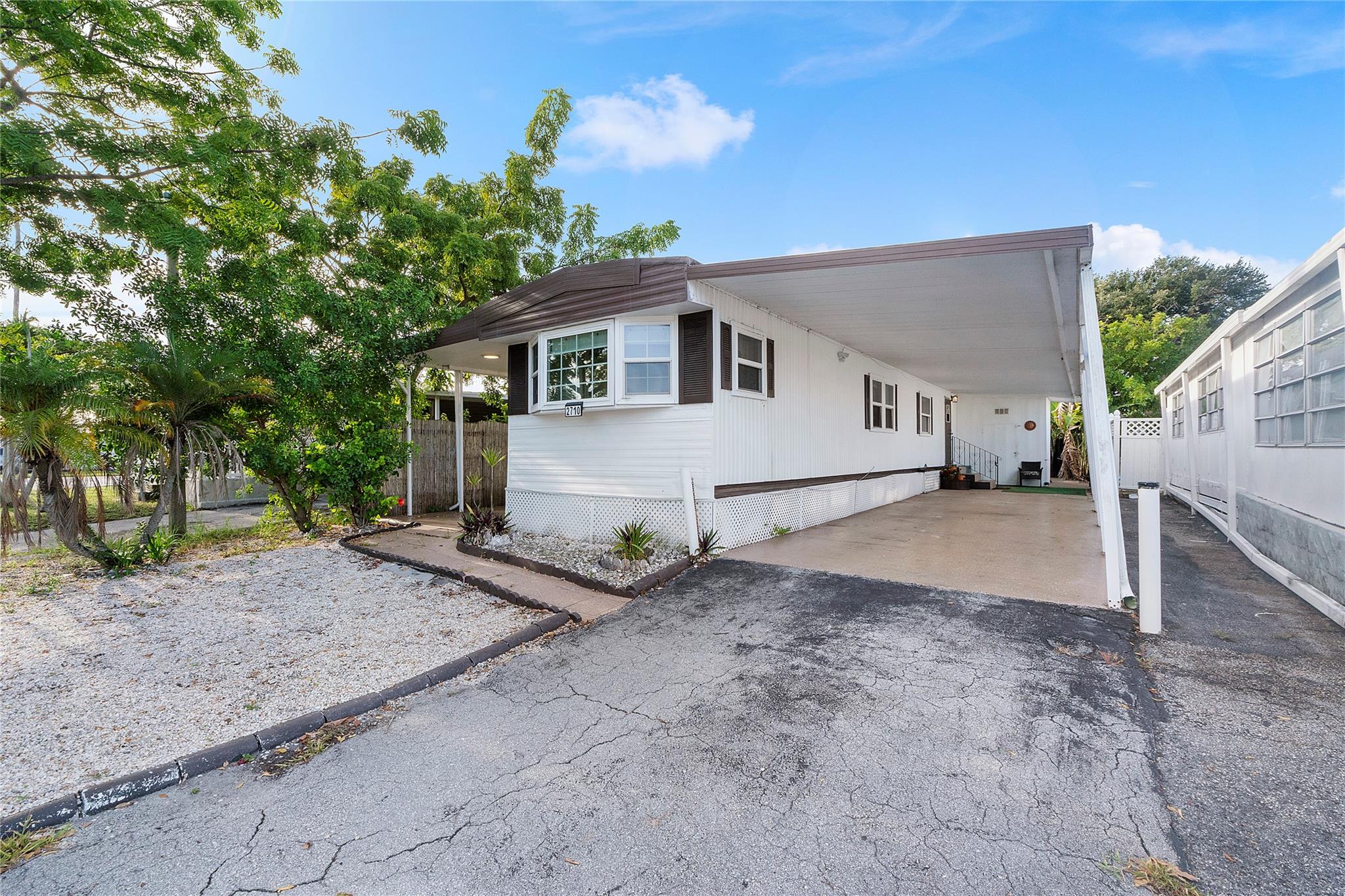 Charming 2-bedroom, 2-bath manufactured home for rent with a private backyard. Features a spacious kitchen equipped with stainless steel appliances. Enjoy a long driveway and a carport with ample parking space. Located in an all-ages community offering great amenities including a pool, jacuzzi, bowling, and more. Conveniently close to the Hard Rock Casino, restaurants, major highways, public transportation, the airport, and just 4 miles from the beach.