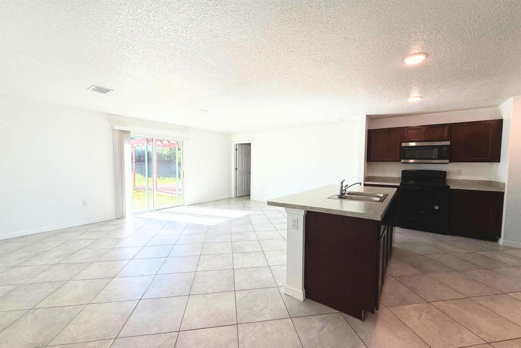 Photo of 566 SW Grove Avenue, Port Saint Lucie, FL 34983 (MLS # R11043130)