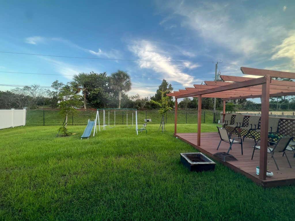 Photo of 566 SW Grove Avenue, Port Saint Lucie, FL 34983 (MLS # R11043130)