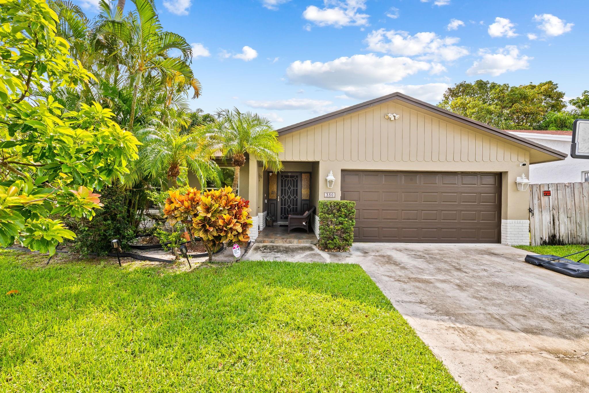 Welcome to your own slice of South Florida paradise in beautiful Deerfield Beach. This charming 3 bedroom 2 bathroom with a 2 car garage single family home is nestled in a desirable neighborhood just minutes from the natural beauty and recreational amenities of Quiet Waters Park. With a sparkling private pool , lush landscaping and a spacious floorplan, this home blends indoor comfort with the laid back Florida lifestyle.