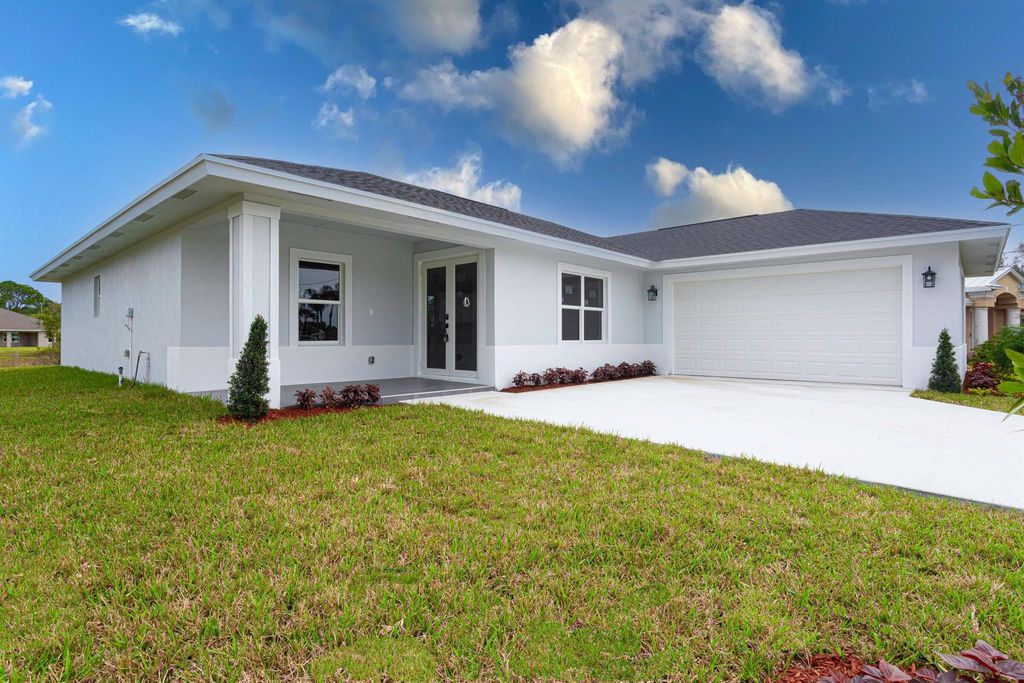Photo of 6153 NW East Deville Circle, Port Saint Lucie, FL 34986 (MLS # R10995301)