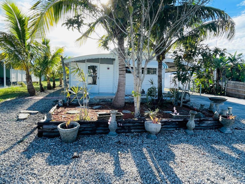 Photo of 8026 SE Wren Avenue, Hobe Sound, FL 33455 (MLS # B26013094)