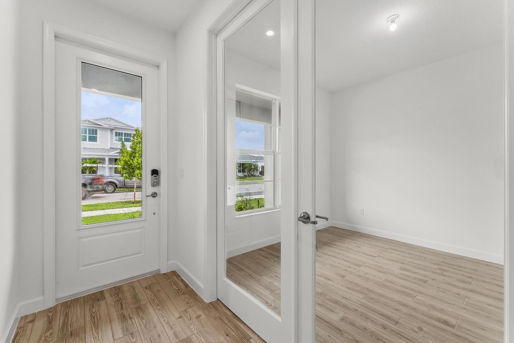 Photo of 9555 SW Indra Way, Port Saint Lucie, FL 34987 (MLS # R11103035)