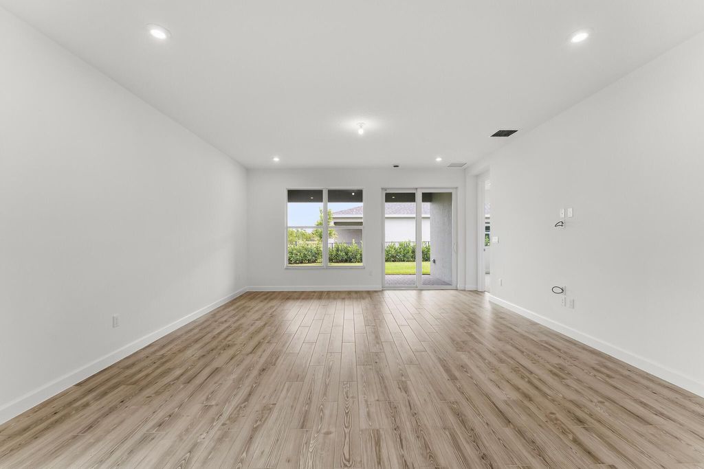Photo of 9555 SW Indra Way, Port Saint Lucie, FL 34987 (MLS # R11103035)