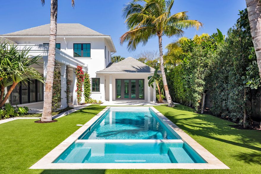 Situated on an oversized 13,425 sq. foot lot with a private back alley entrance to the properties three car garage, rests the stunning contemporary new construction home featuring 6 bedrooms, 7 full bathrooms and two 1/2 bathrooms. Architecture by Dailey Janssen, designed by Hive Palm Beach and built by the Cury Group, this luxurious designer made home is turnkey. Hosting the best of the best, the kitchen incorporates a 48'' Wolf 8-burner gas range, a Bosch dishwasher, a Subzero fridge/freezer, and fixtures by Waterworks. Adjacent to the magnificent kitchen and great room is a thoughtful butler's pantry with quartzite countertops, an additional Bosch dishwasher and Subzero fridge & freezer drawers. This home incorporates two staircases each leading you to 2 separate guest bedrooms. Above the primary bedroom hosts 2 of the en-suite bedrooms while the other two guest bedrooms are uber private with a designated staircase above the living room overlooking the pool.
With views of the lush landscaping, swimming pool and cabana from just about every angle, this home and its grounds are ideal for entertaining guests while also being perfectly proportioned to feel cozy and comfortable alone at home with family/ friends on the sofa. Close to area beaches, Worth Avenue shopping, A-rated restaurants, and top tier schools.