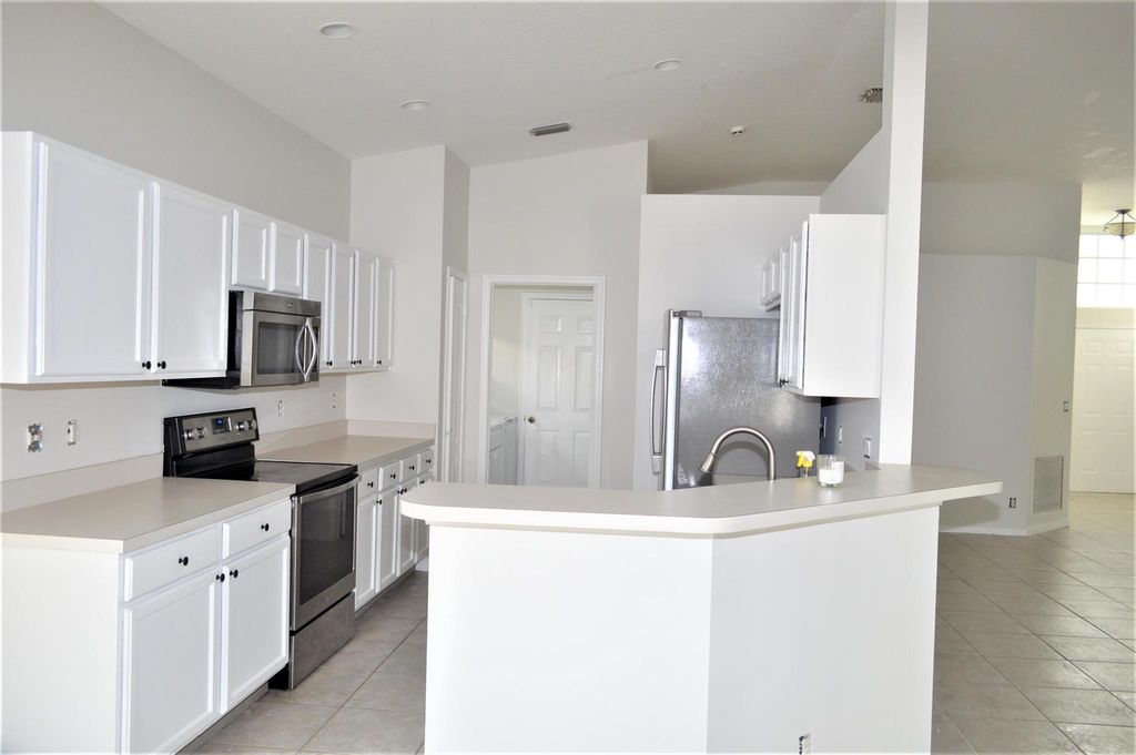 Photo of 880 NW Waterlily Place, Jensen Beach, FL 34957 (MLS # R11038742)