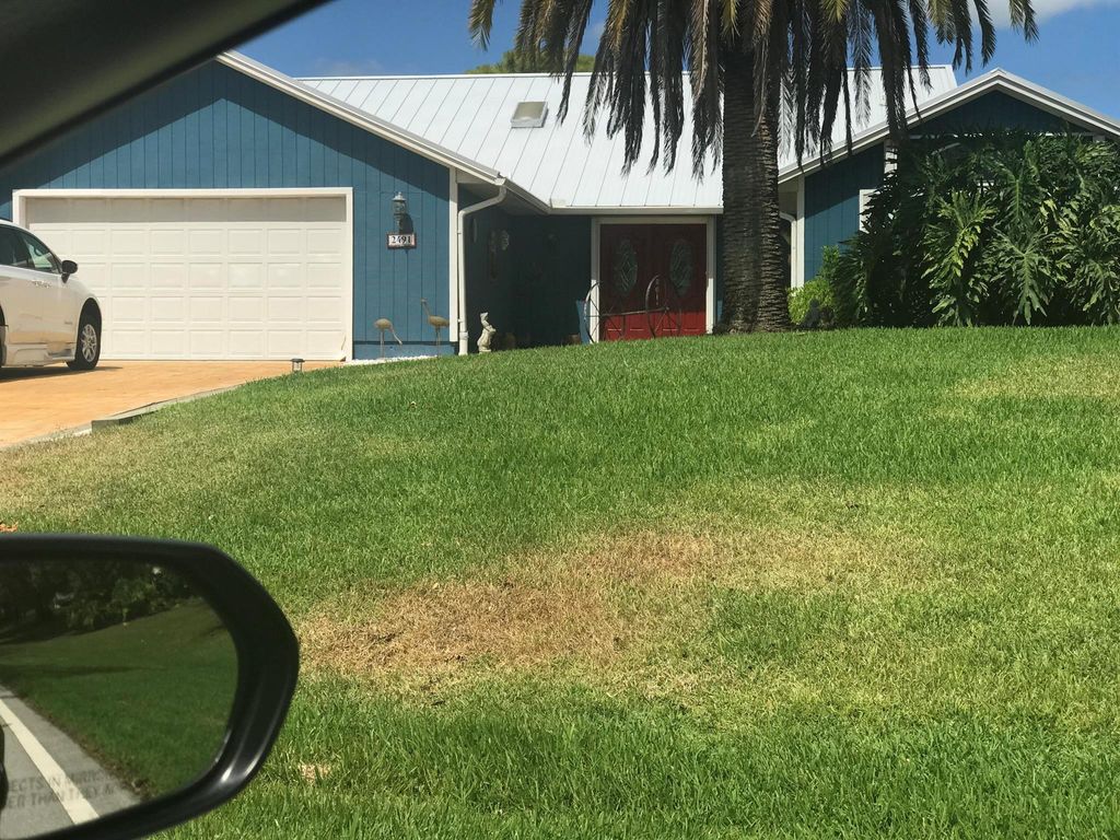 Photo of 2491 NE Pinecrest Lakes Boulevard, Jensen Beach, FL 34957 (MLS # R10887499)