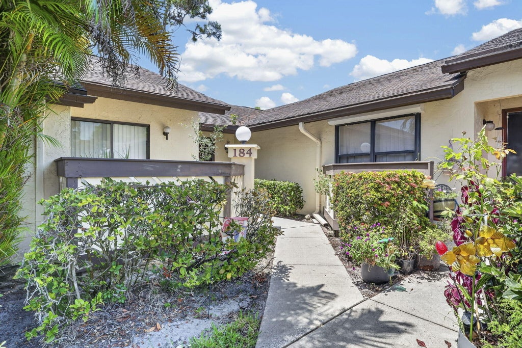 Photo of 184 MASTIC TREE Court, Royal Palm Beach, FL 33411 (MLS # B26066354)