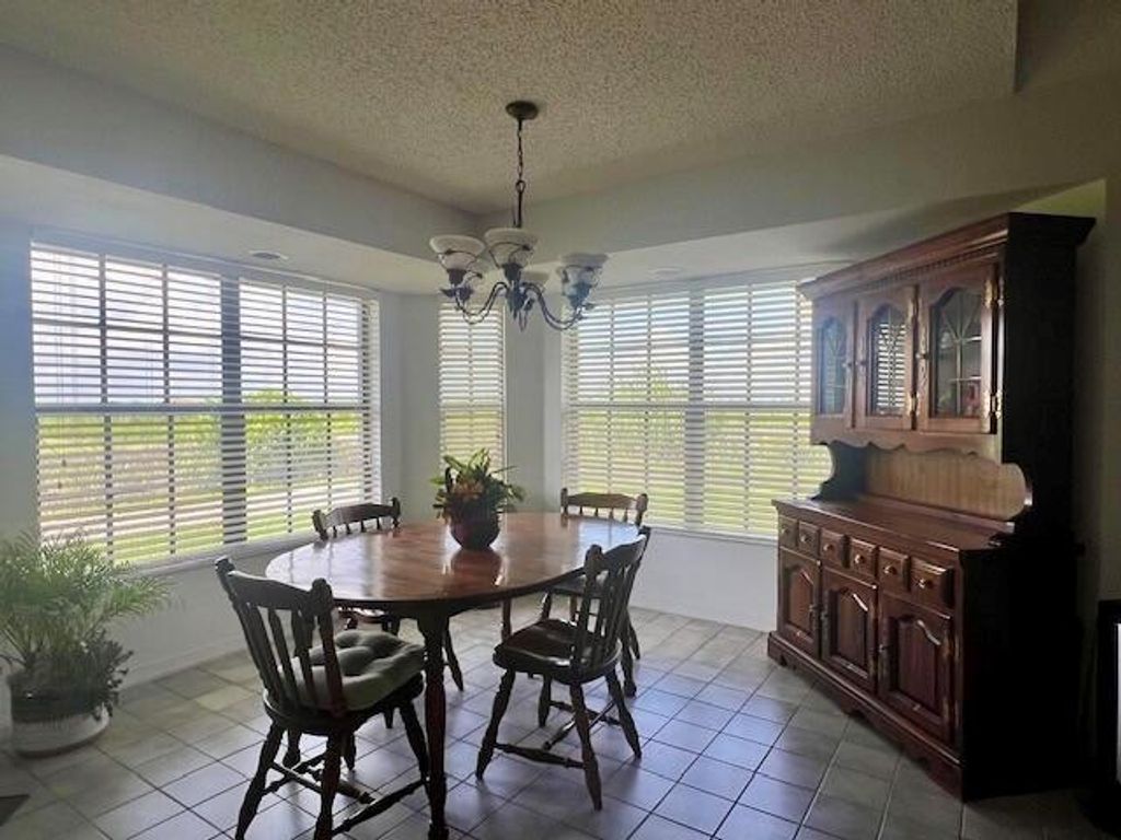 Photo of 333 NE 7th Street, Belle Glade, FL 33430 (MLS # R10999193)