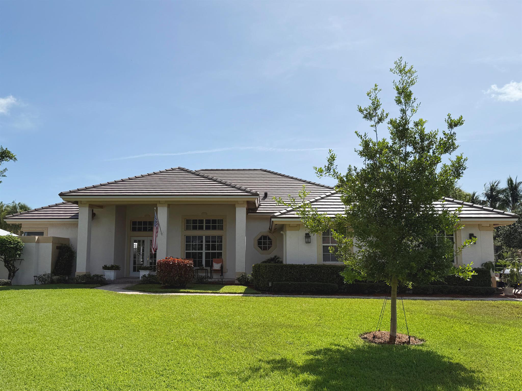 The Sanctuary, an exclusive Hobe Sound ocean-access gated community of just 57 homes, is located on the Indian River, adjacent to Peck Lake Park, next to Loblolly. Beautiful, meticulously maintained CBS home sits on a corner lot with utmost privacy surrounding a screened pool. Roof 2025, a/c;s 2017; htw 2018. Split floor plan with primary br opening out to the pool; on opposite side, a guest ensuite bedroom also has sliders to pool. Two additional generous sized bedrooms share a full bath between. Crown molding adorns the living space. With an open kitchen-family room, a formal living room and formal dining room, this popular floorplan works for everyone! This community is a hidden jewel! Steps away from the community boat slips, stroll down and observe water & greenspace. A must see!