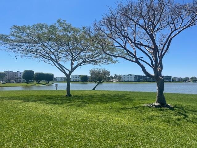 PRICED TO SELL! Immediate rental, annually only, no LLC's. 55+ community. Spacious 2 beds, 2 full baths with stunning tranquil views of the lake and garden from screened in lanai. sliding doors from both bedrooms with a view, Porcelain floors throughout, newer AC and water heater. freshly painted. Immaculate! Great location, across from the pool and courtesy bus stop and house of worship.Wonderful 4th floor summer breeze, laundry on floor. Elevator, 24 hour manned gate. Amenities include: heated pools, ballroom, game room, full fitness center, tennis, gym and much more.