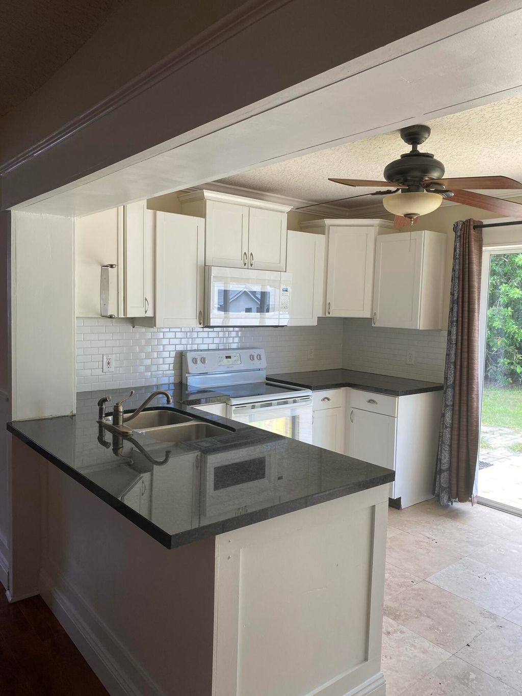 Photo of 1057 SW Spruce Street, Palm City, FL 34990 (MLS # R11000124)