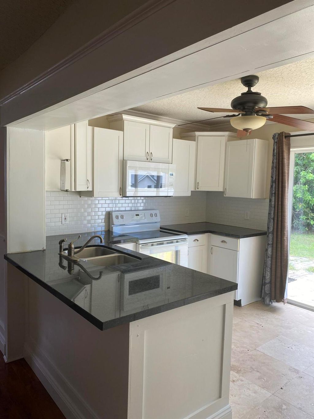 Photo of 1057 SW Spruce Street, Palm City, FL 34990 (MLS # R11000124)