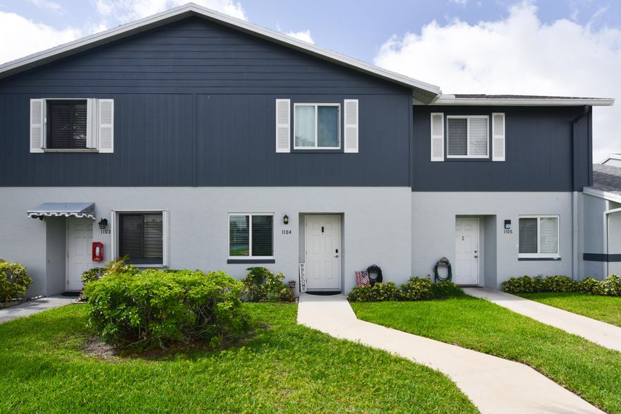 Beautifully maintained 2-story townhouse in a desirable 55+ community featuring two spacious primary ensuite bedrooms. Thoughtfully upgraded with a fully remodeled kitchen, modern finishes, and renovated bathrooms with large walk-in showers.  Enjoy luxury vinyl plank flooring on the first floor and durable laminate upstairs, complemented by crown molding with remote lighting and 6" baseboards. Impact windows offer storm protection, while a newer A/C and water heater provide added peace of mind.  Relax or entertain in your private backyard with a screened porch and an extended brick-paver patio. Move-in ready with stylish upgrades and low-maintenance living.