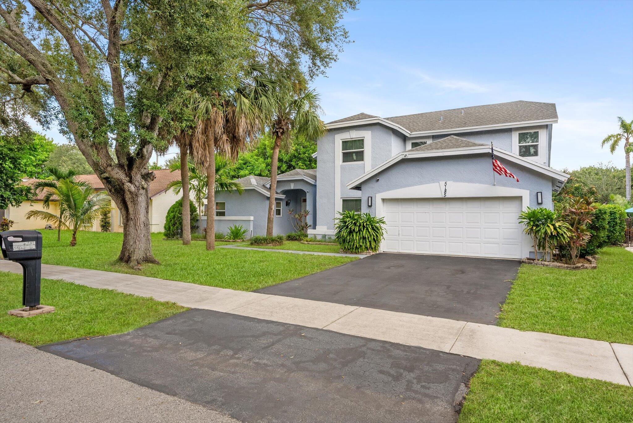 Welcome to this beautifully renovated two-story residence featuring 4 bedrooms and 3 full bathrooms, along with a spacious 2-car garage, located in the highly desirable Winston Park community in the heart of Coconut Creek. This move-in-ready home has been thoughtfully updated throughout, showcasing brand new impact glass windows, newer stainless steel appliances, a 2018 hot water heater, a 2022 A/C unit, and a whole-house water filtration system for enhanced comfort, efficiency, and peace of mind. Inside, you'll find fresh interior paint and laminate wood flooring throughout. The sleek and modern kitchen features upscale cabinetry, beautiful white quartz countertops, and an expanded eat-in island that opens to the living space--overlooking a private, fully fenced backyard with tranquil