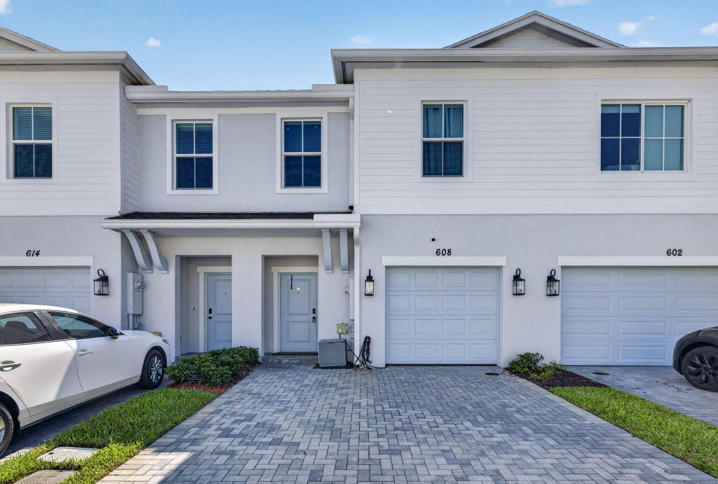 Photo of 608 NE WATERS EDGE Lane, Port Saint Lucie, FL 34983 (MLS # B26053382)