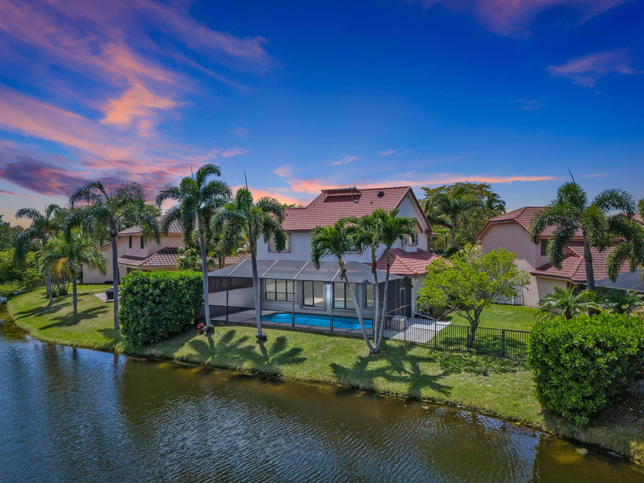 NEW PRICE! 4/3 prime lakefront home w/screened in pool located in the Island like community of Mayfair at Jacaranda. Remodeled custom kitchen with upgraded quartz island & counters and a gorgeous spa like master bathroom. Additional features: solar water heater, high hat lighting, freshly painted interior/exterior, Popcorn ceilings removed, tons of closets, culdesac location, Complete accordian shutters, larger pie shaped lot and gated community at night. Completly fenced in side yard and plenty of room for the dog and children to play. A full bathroom and bedroom located on the first floor that could be used as an in-law-suite or office. Living room could become a 5th bedroom if needed. Possible school Reassignment considered. Excellent Plantation location. Dont miss this opportunity!