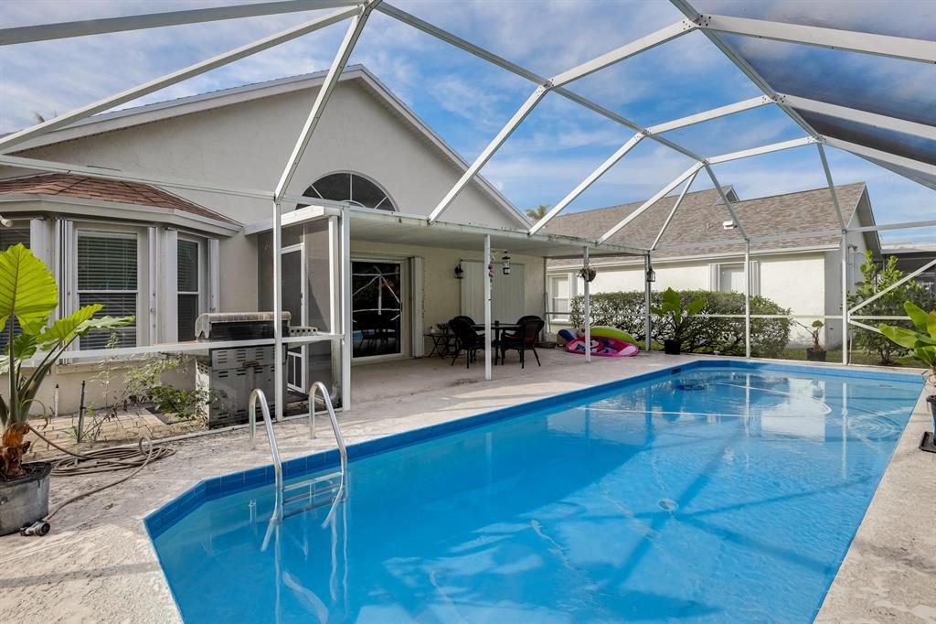 Photo of 151 Hammocks Drive, Greenacres, FL 33413 (MLS # R10888499)