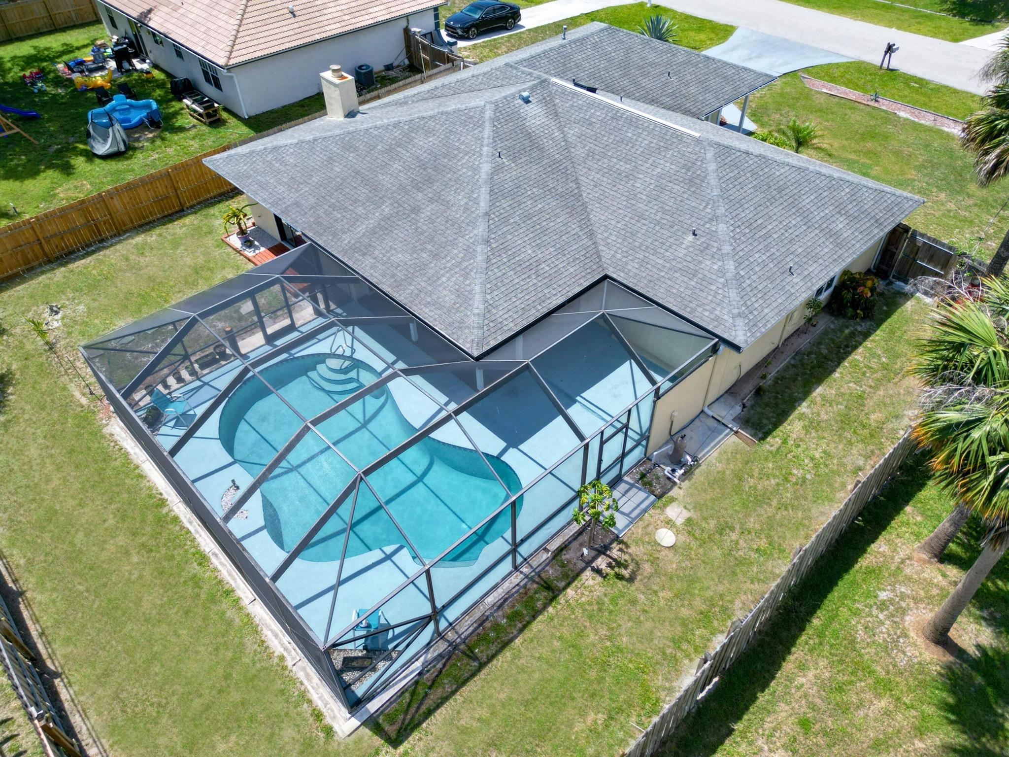 Immaculate 3/2 Home on beautiful lot. Open Layout w/ a beautiful screened pool! Beautiful tropical landscaping, fenced yard, Abundant Natural Light, Spacious Kitchen w/lovely breakfast nook overlooking the pool. both the family room & dining areas. This spacious floor plan features split bedrooms w/the Primary suite in it's own private wing of the home. Your guests will enjoy their secluded retreat with guest bedroom & sunlit full bath. Quiet screened patio overlooking the sparkling blue pool. Port St Lucie offers a miles of open space, gorgeous waterways, parks, endless entertainment & minutes from world class fishing, Golf & beaches!